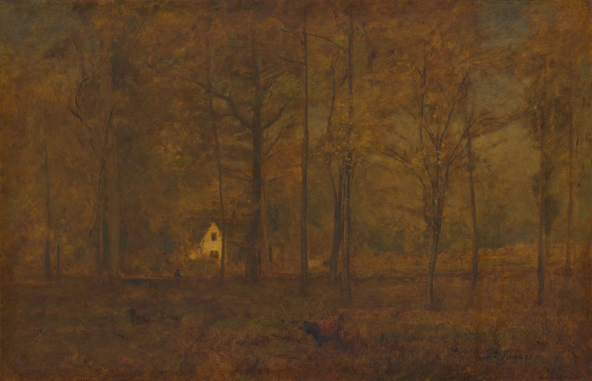 A hazy orange and brown forest with a small pale house among the trees.